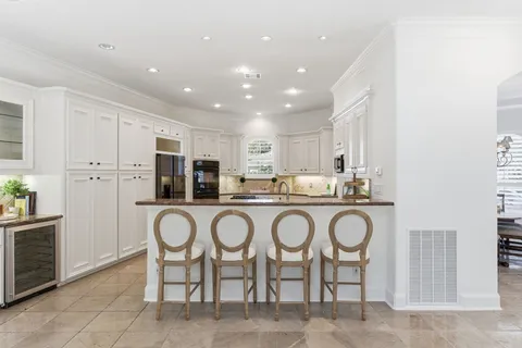 a view of a patio with a dining table and chairs