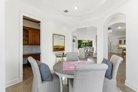 a bathroom with a granite countertop sink and shower