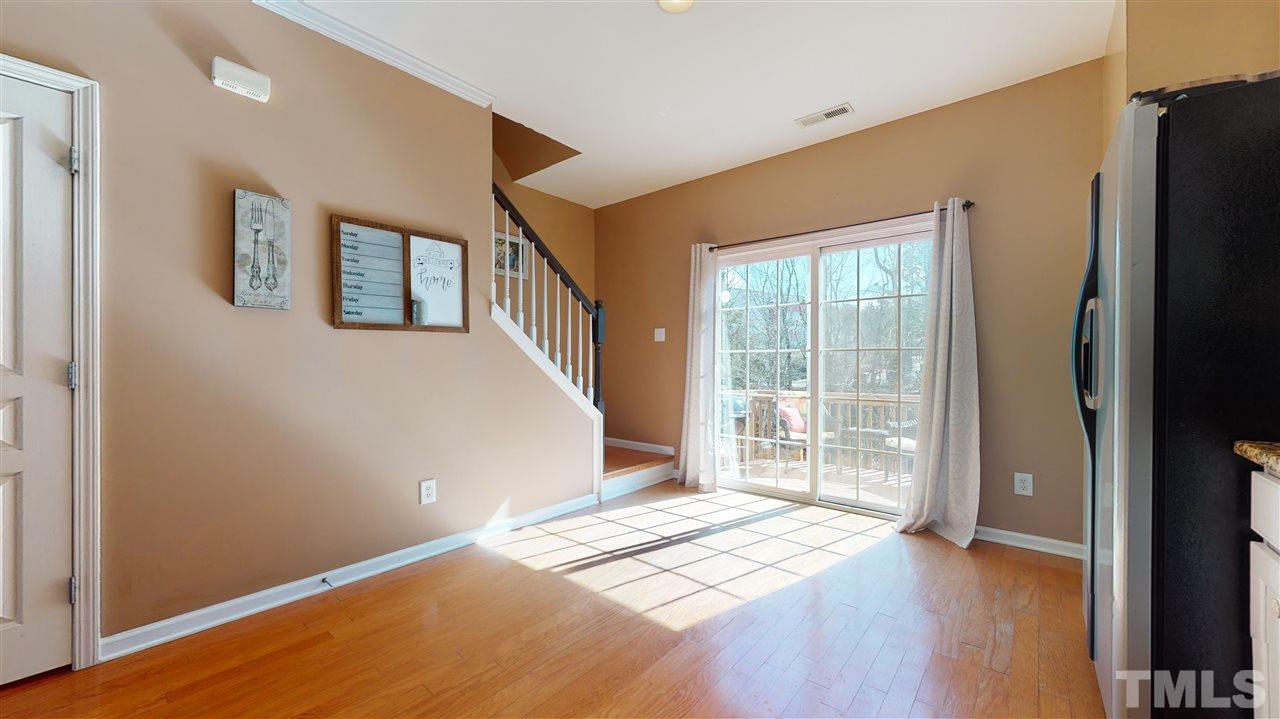 7621 Winners Edge Street Raleigh, NC 27617 - Photo 12 of 30 a view of an empty room with glass door