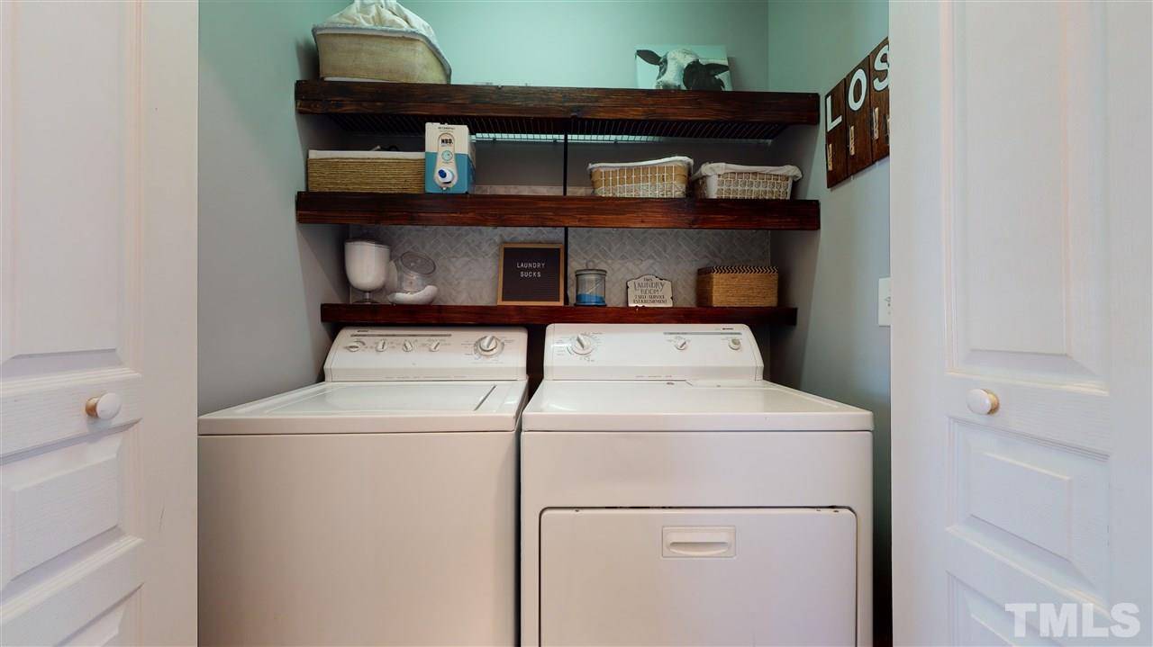7621 Winners Edge Street Raleigh, NC 27617 - Photo 15 of 30 a close up view of washer and dryer