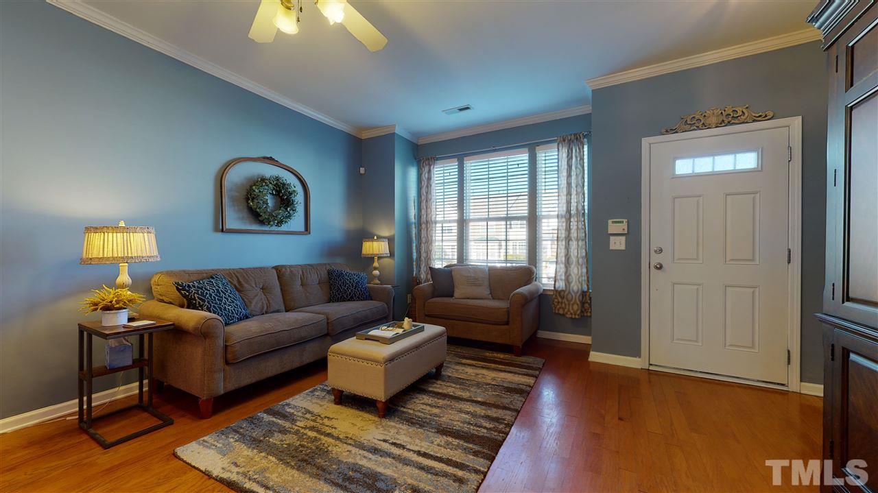 7621 Winners Edge Street Raleigh, NC 27617 - Photo 3 of 30 a living room with furniture and a window
