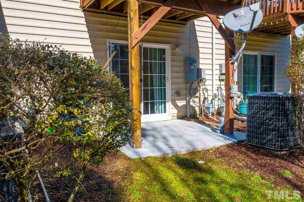 7621 Winners Edge Street Raleigh, NC 27617 - Photo 26 of 30 a front view of a house with a yard