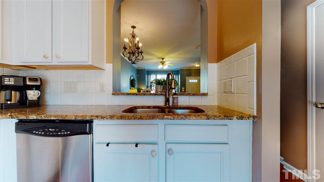 7621 Winners Edge Street Raleigh, NC 27617 - Photo 9 of 30 a bathroom with a sink and a mirror
