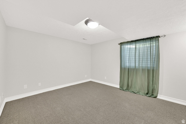 4792 Glasmann Way South Ogden, UT 84403 - Photo 60 of 70 Bedroom #4 carpeted room with light grey walls, white baseboards, and a single window with a green sheer curtain
