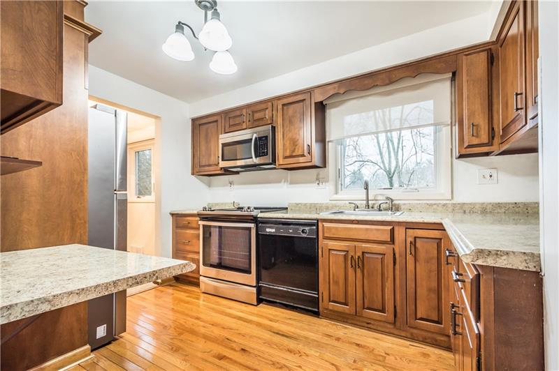 206 West Bruceton Road Pittsburgh, PA 15236 - Photo 3 of 23 UPDATED STAINLESS APPLIANCES, gorgeous hardwood flooring, and cherry cabinets adorn this kitchen.
