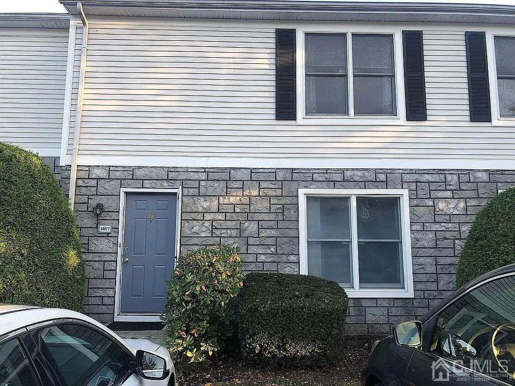 4607 Hana Road Edison, NJ 08817 - Photo 1 of 1 a front view of a house with a yard