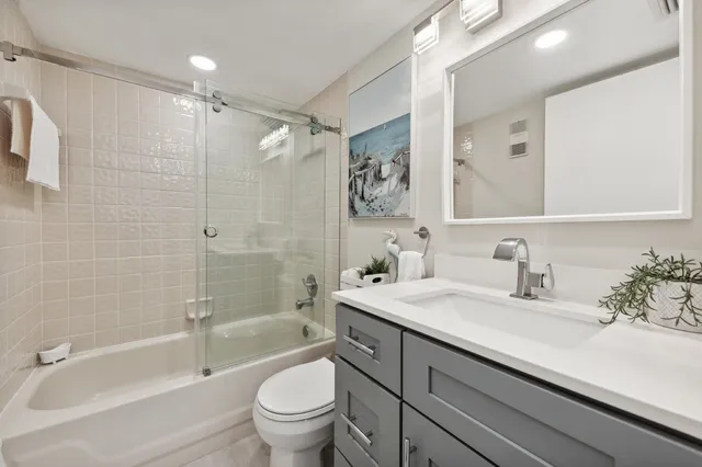 a bathroom with a sink a toilet and a bathtub