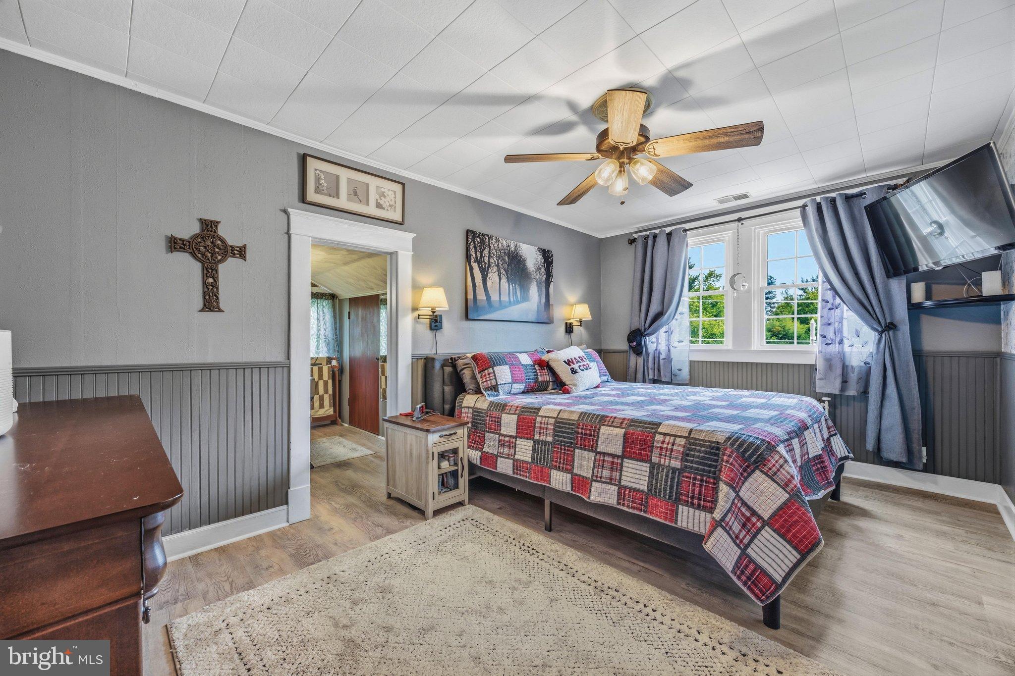 522 Old Hammonds Ferry Road Linthicum Heights, MD 21090 - Photo 24 of 109 Cozy bedroom with charming rustic accents.