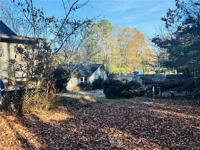 a backyard of a house with lots of green space