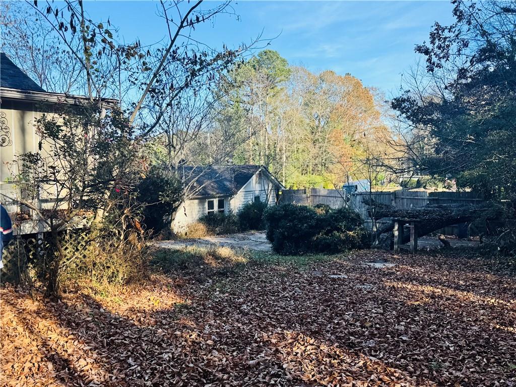 1041 South Hairston Road Stone Mountain, GA 30083 - Photo 3 of 6 a backyard of a house with lots of green space