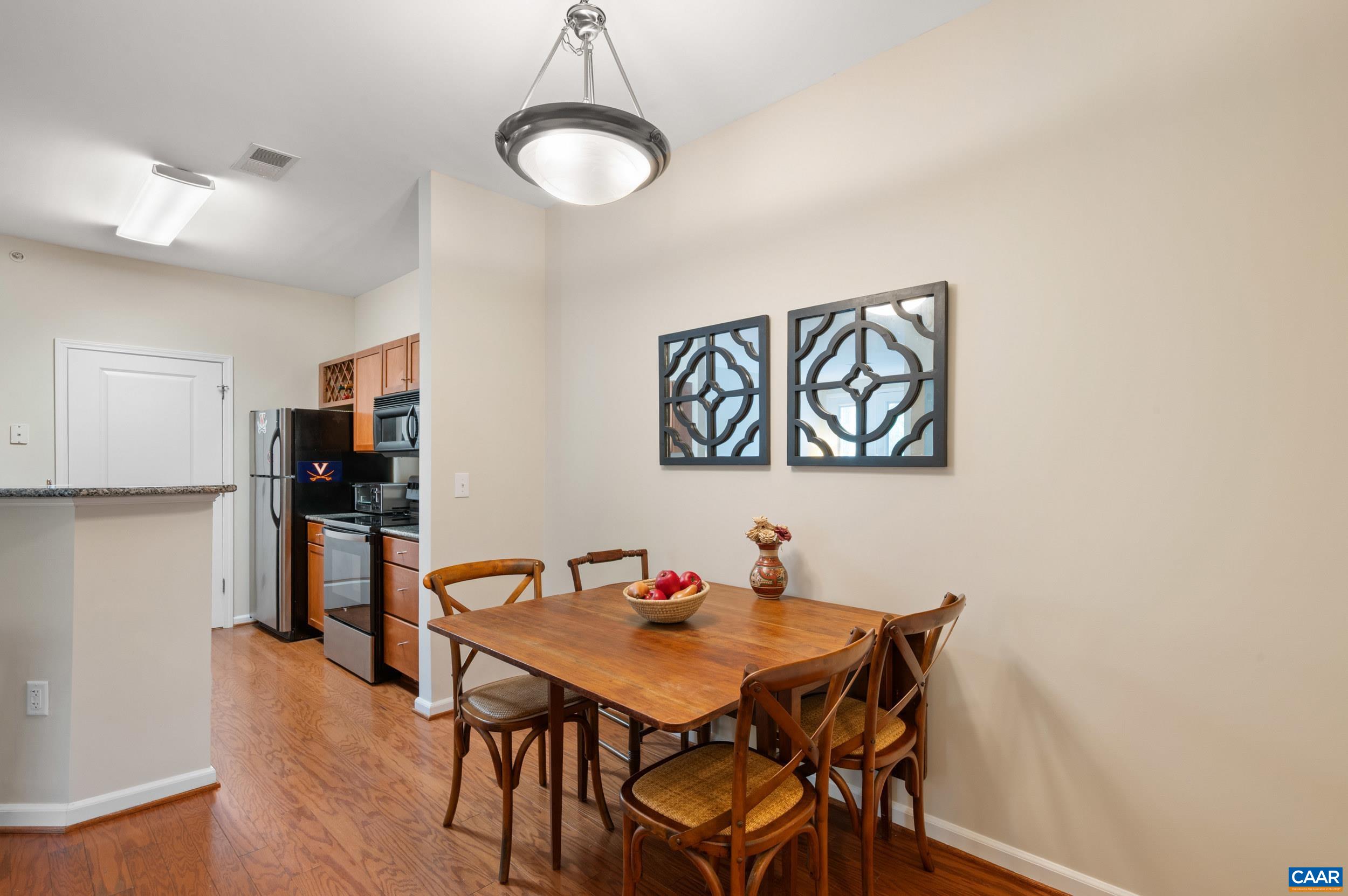 765 Walker Square, Unit 2D Charlottesville, VA 22903 - Photo 4 of 33 a view of a dining room with furniture