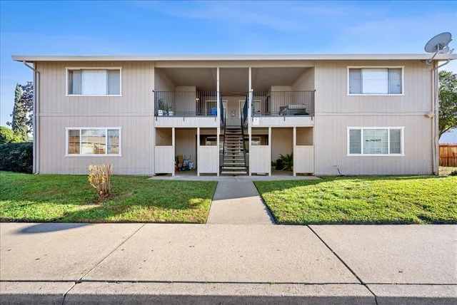 front view of a house with a yard