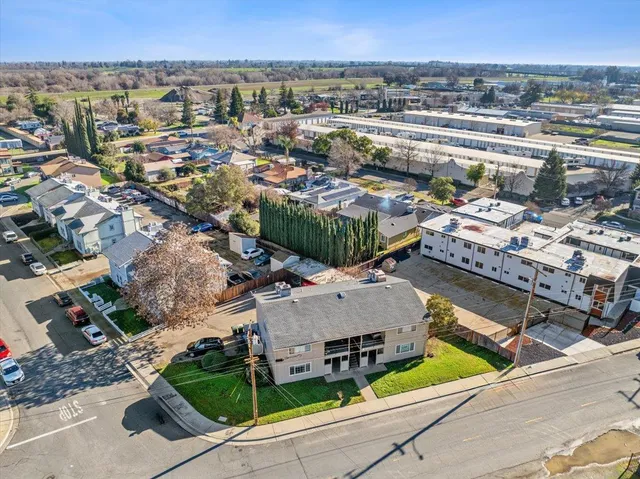 an aerial view of a house with a swimming pool