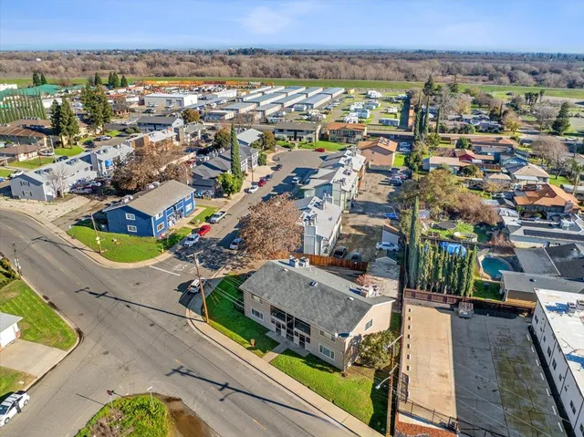 a car parked in front of brick house