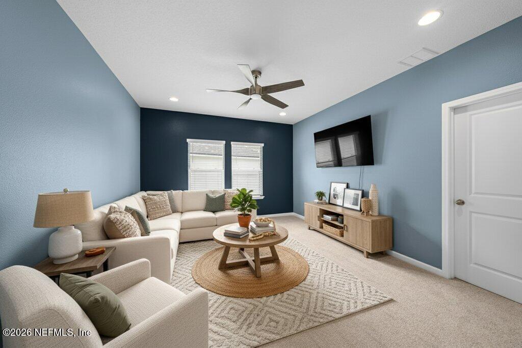 200 Starnberg Ct Street St. Augustine, FL 32095 - Photo 19 of 48 a living room with furniture a ceiling fan and a flat screen tv