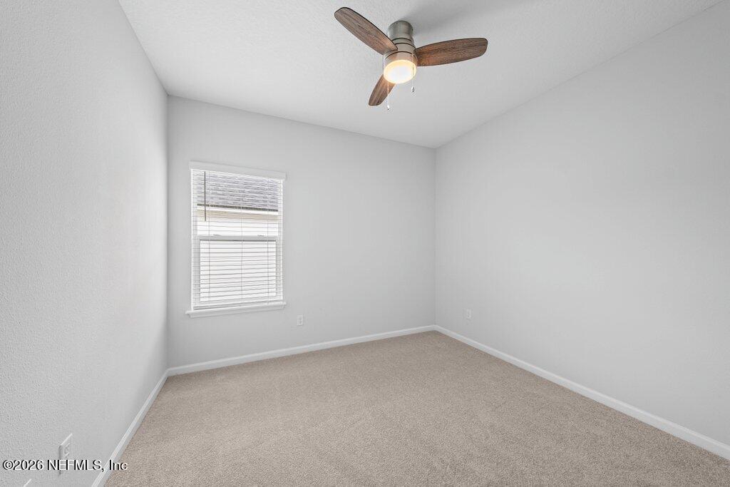 200 Starnberg Ct Street St. Augustine, FL 32095 - Photo 26 of 48 an empty room with a window and a ceiling fan