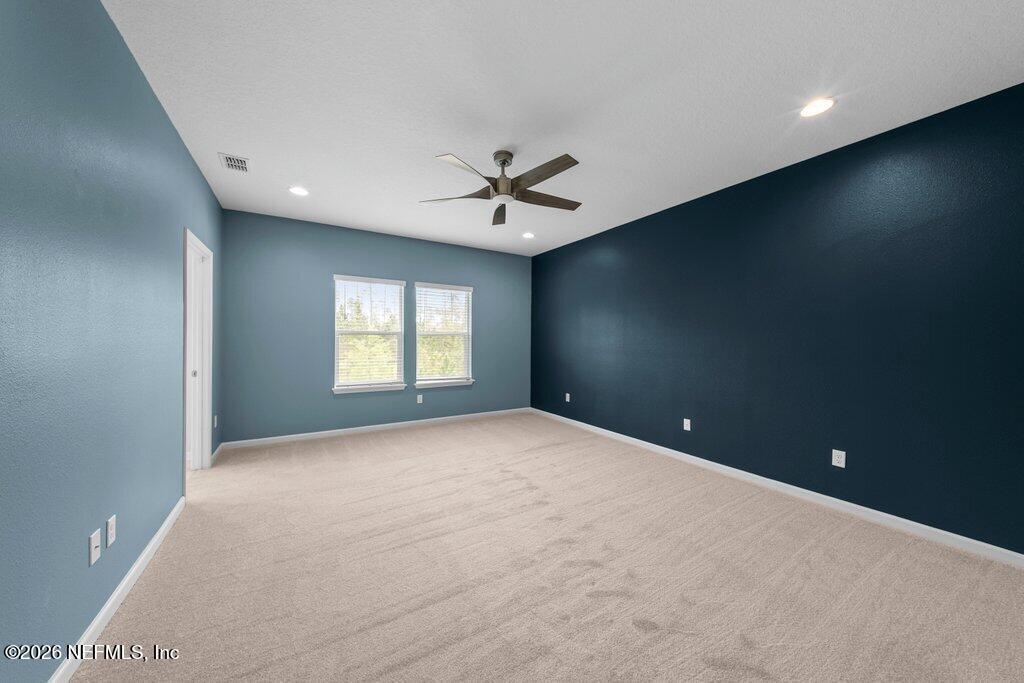 200 Starnberg Ct Street St. Augustine, FL 32095 - Photo 27 of 48 an empty room with a ceiling fan and window