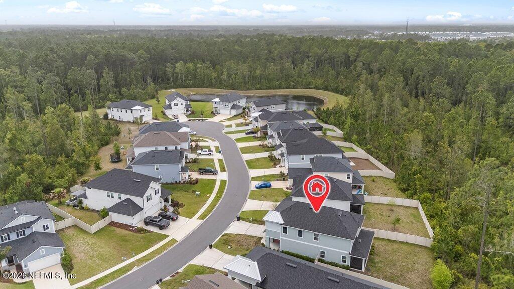 200 Starnberg Ct Street St. Augustine, FL 32095 - Photo 3 of 48 an aerial view of a house with a garden