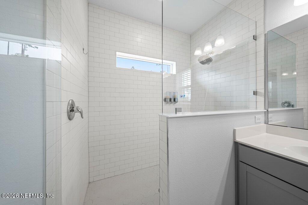 200 Starnberg Ct Street St. Augustine, FL 32095 - Photo 31 of 48 a bathroom with a sink shower and a mirror