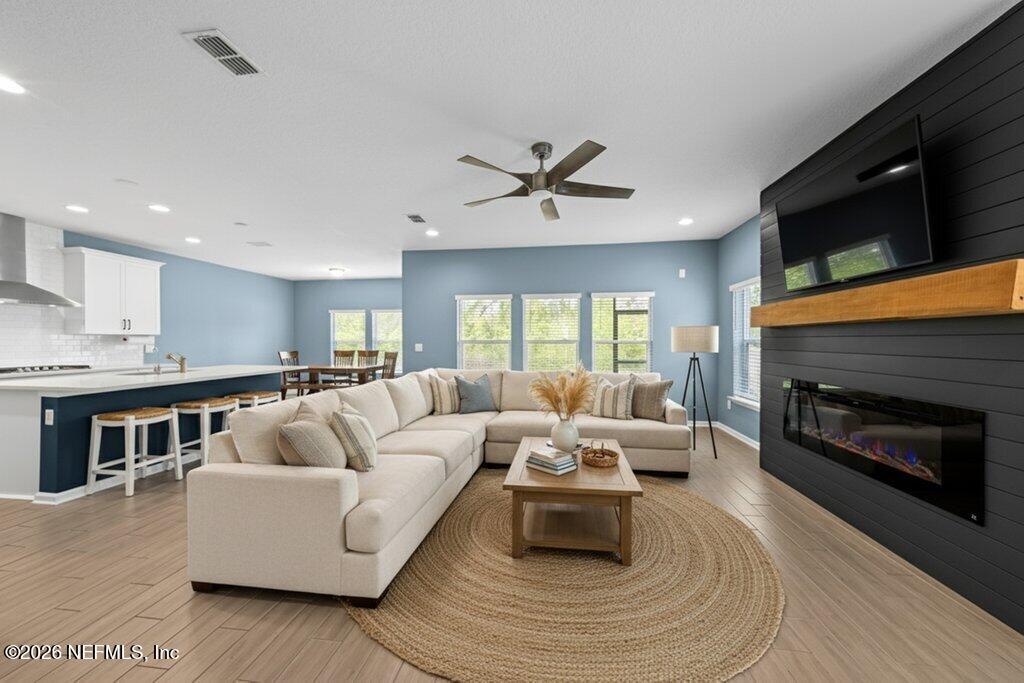 200 Starnberg Ct Street St. Augustine, FL 32095 - Photo 40 of 48 a living room with furniture fireplace and flat screen tv