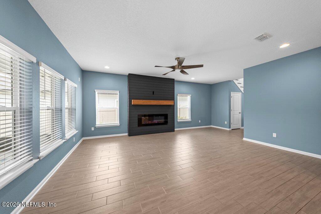 200 Starnberg Ct Street St. Augustine, FL 32095 - Photo 42 of 48 a view of an empty room with a fireplace and a window