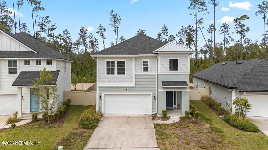 200 Starnberg Ct Street St. Augustine, FL 32095 - Photo 7 of 48 a front view of a house with garden