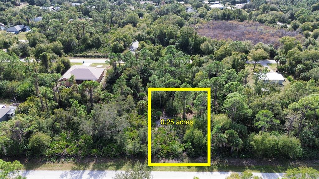 23431 Racine Avenue Punta Gorda, FL 33980 - Photo 1 of 4 an aerial view of a house with swimming pool and garden
