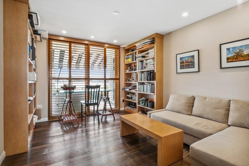 2160 Ibis Isle Road, Unit 1 Palm Beach, FL 33480 - Photo 11 of 44 a living room with furniture and a floor to ceiling window