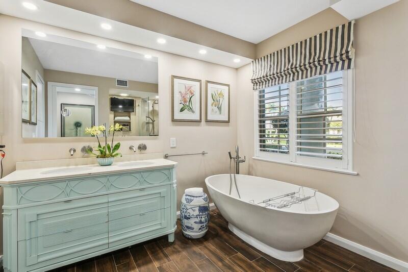 2160 Ibis Isle Road, Unit 1 Palm Beach, FL 33480 - Photo 14 of 44 a bathroom with a bathtub and a sink