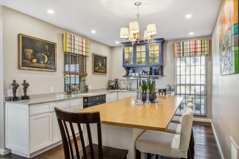 2160 Ibis Isle Road, Unit 1 Palm Beach, FL 33480 - Photo 18 of 44 a view of a dining room with furniture window and wooden floor
