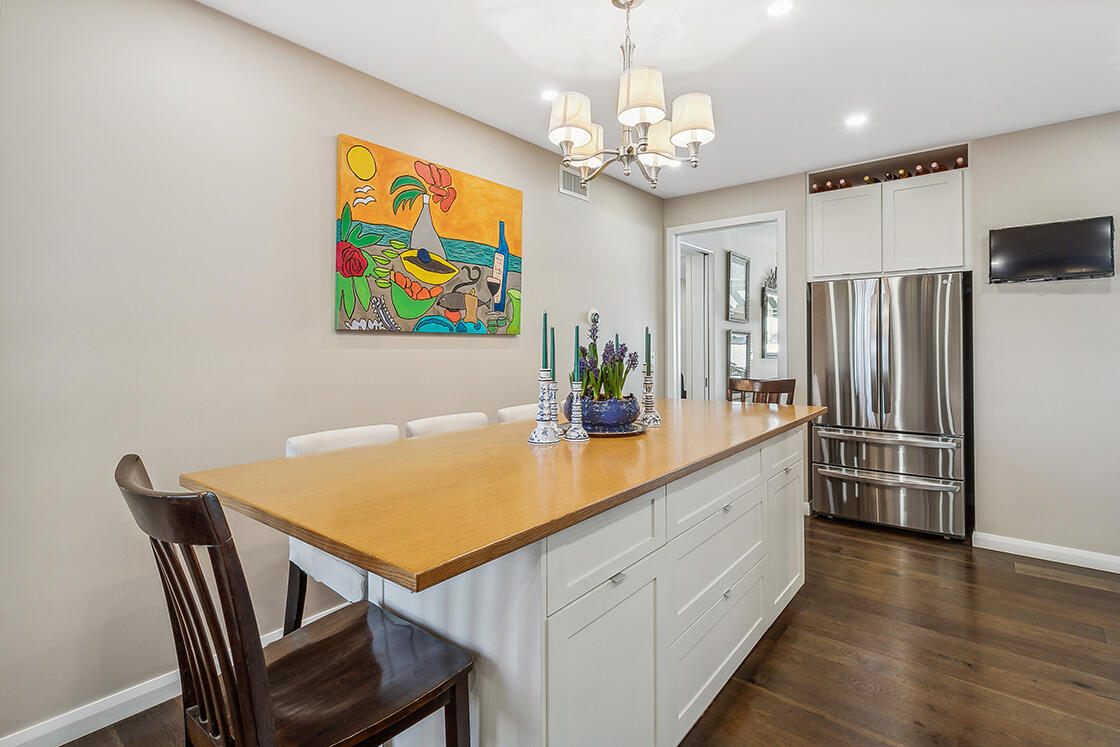 2160 Ibis Isle Road, Unit 1 Palm Beach, FL 33480 - Photo 21 of 44 a view of a dining room with furniture and wooden floor