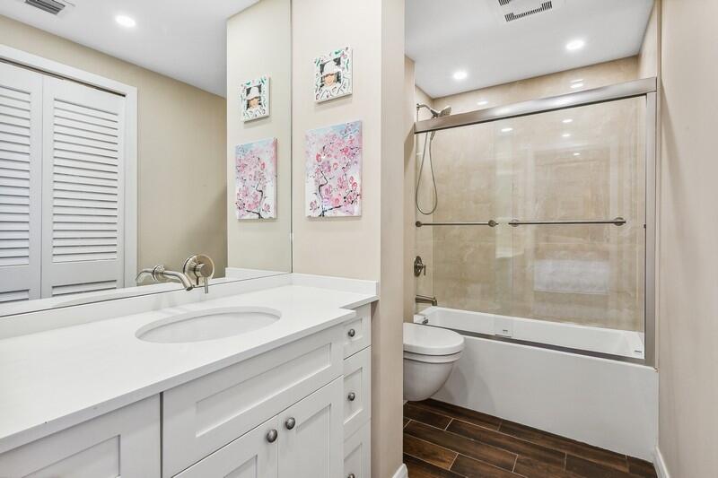2160 Ibis Isle Road, Unit 1 Palm Beach, FL 33480 - Photo 23 of 44 a bathroom with a sink a toilet and shower