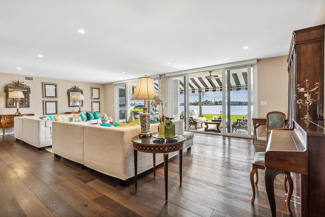 2160 Ibis Isle Road, Unit 1 Palm Beach, FL 33480 - Photo 3 of 44 a living room with furniture and a flat screen tv