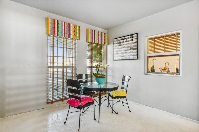 2160 Ibis Isle Road, Unit 1 Palm Beach, FL 33480 - Photo 33 of 44 a dining room with furniture and window