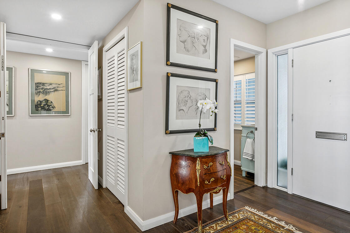 2160 Ibis Isle Road, Unit 1 Palm Beach, FL 33480 - Photo 8 of 44 a view of a livingroom with furniture and wooden floor