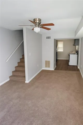 a view of a livingroom with a staircase