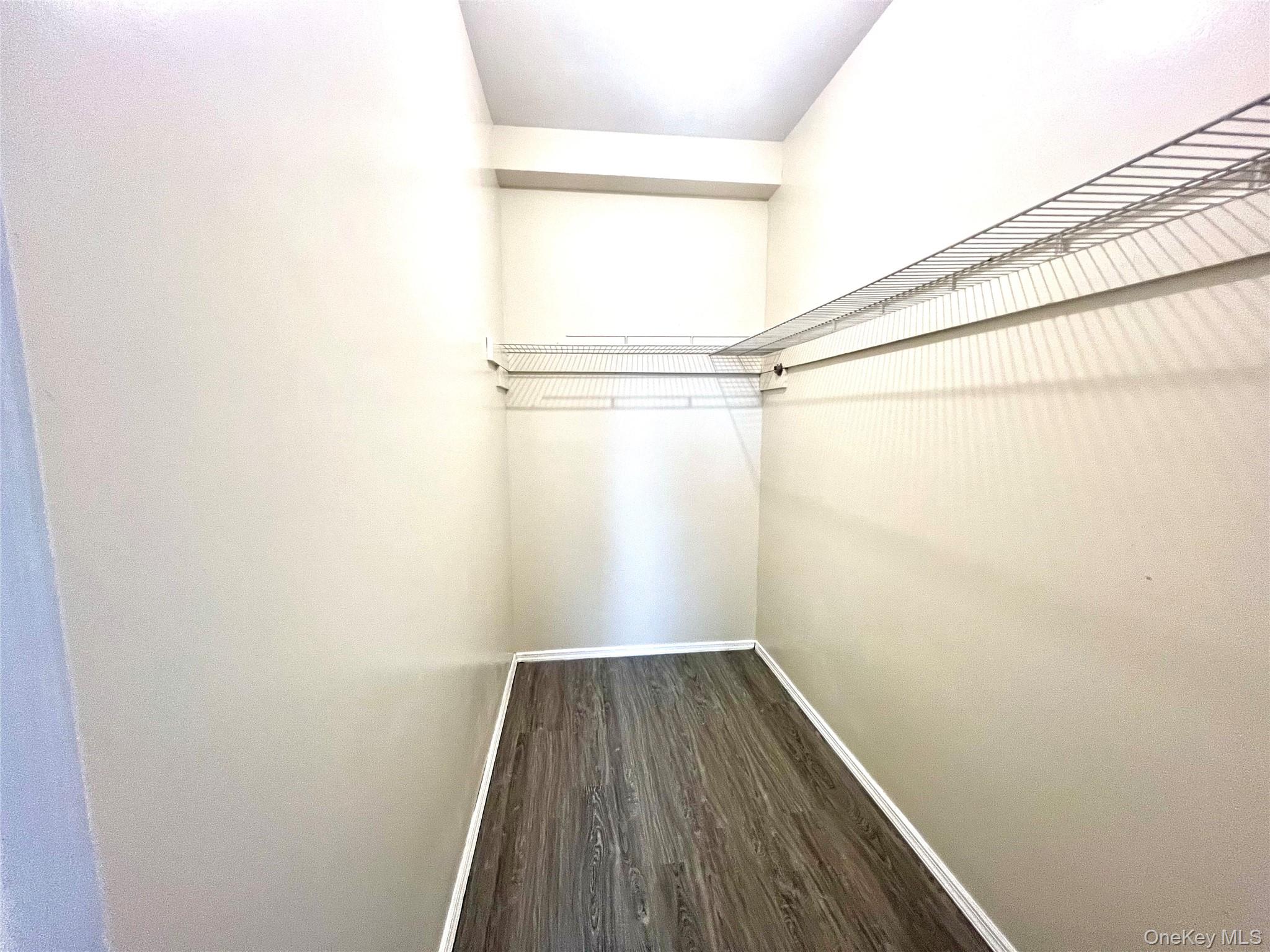 104-04 47th Avenue, Unit 2C Queens, NY 11368 - Photo 7 of 9 a view of a small space with wooden floor and small window