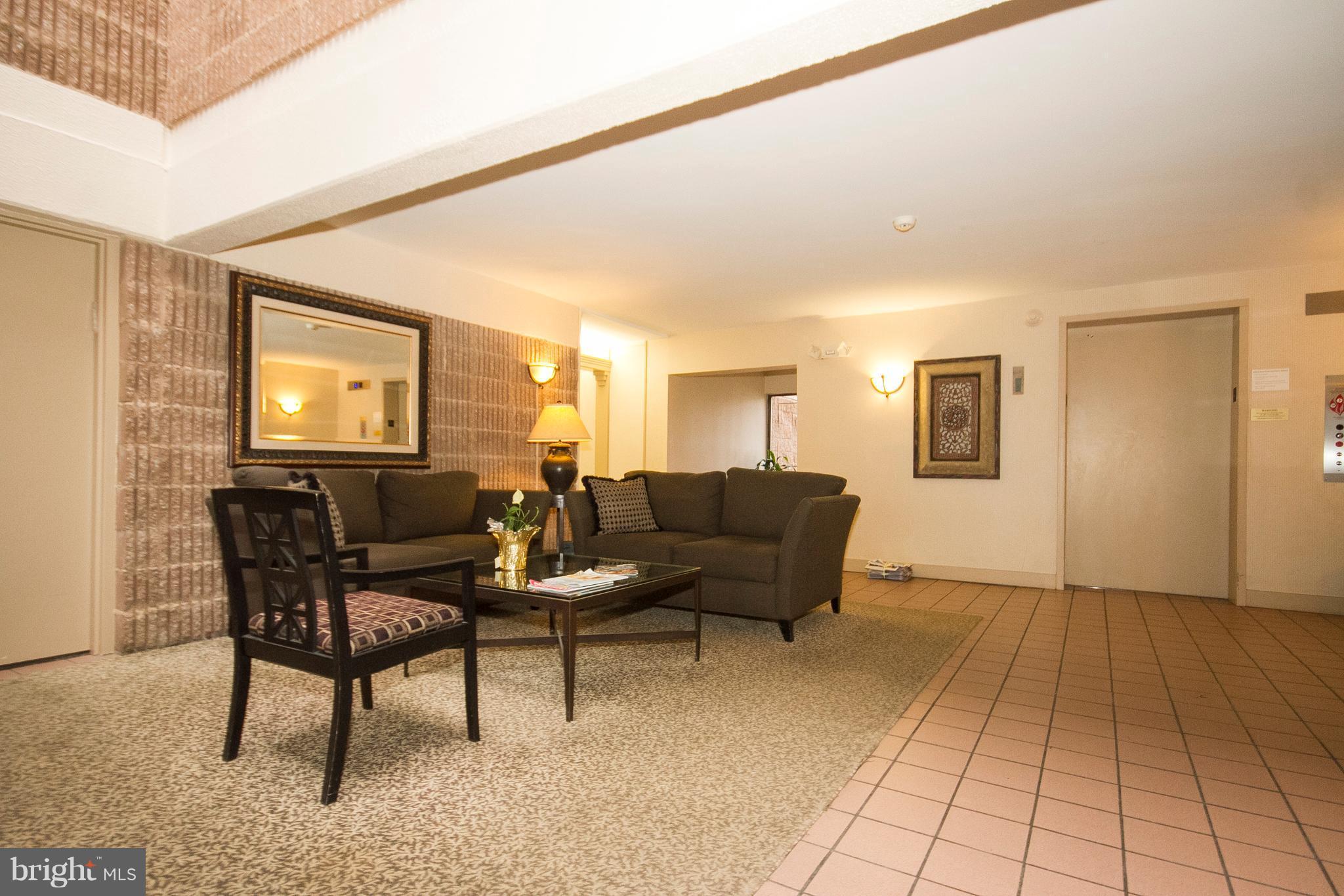 2901 Fallstaff Road, Unit 504 Baltimore, MD 21209 - Photo 2 of 22 a living room with furniture and a window