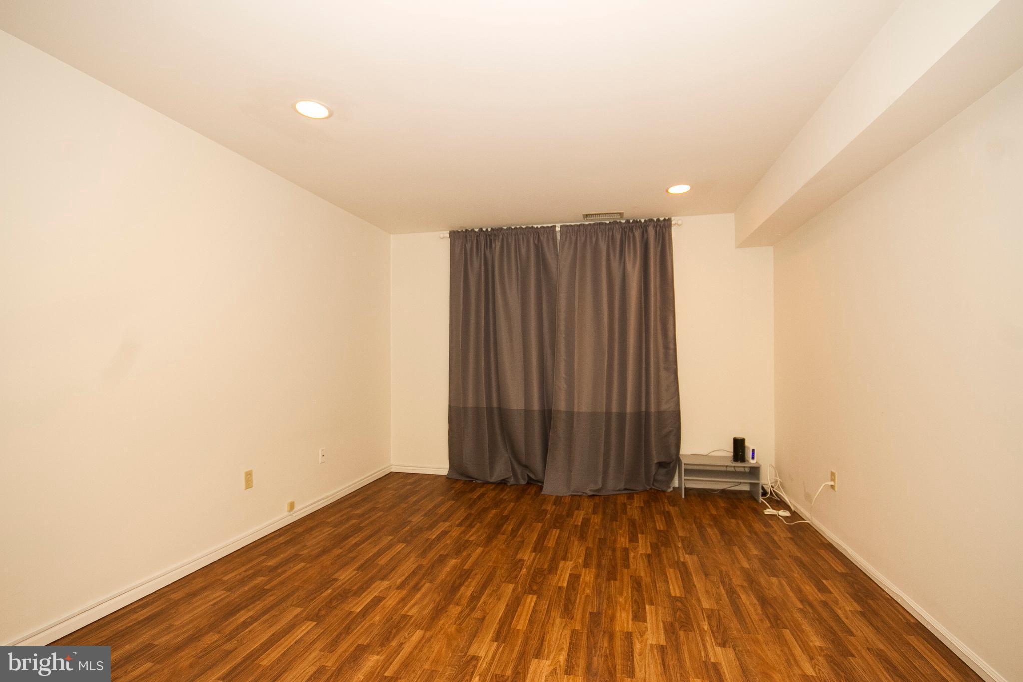 2901 Fallstaff Road, Unit 504 Baltimore, MD 21209 - Photo 12 of 22 a view of a room with wooden floor