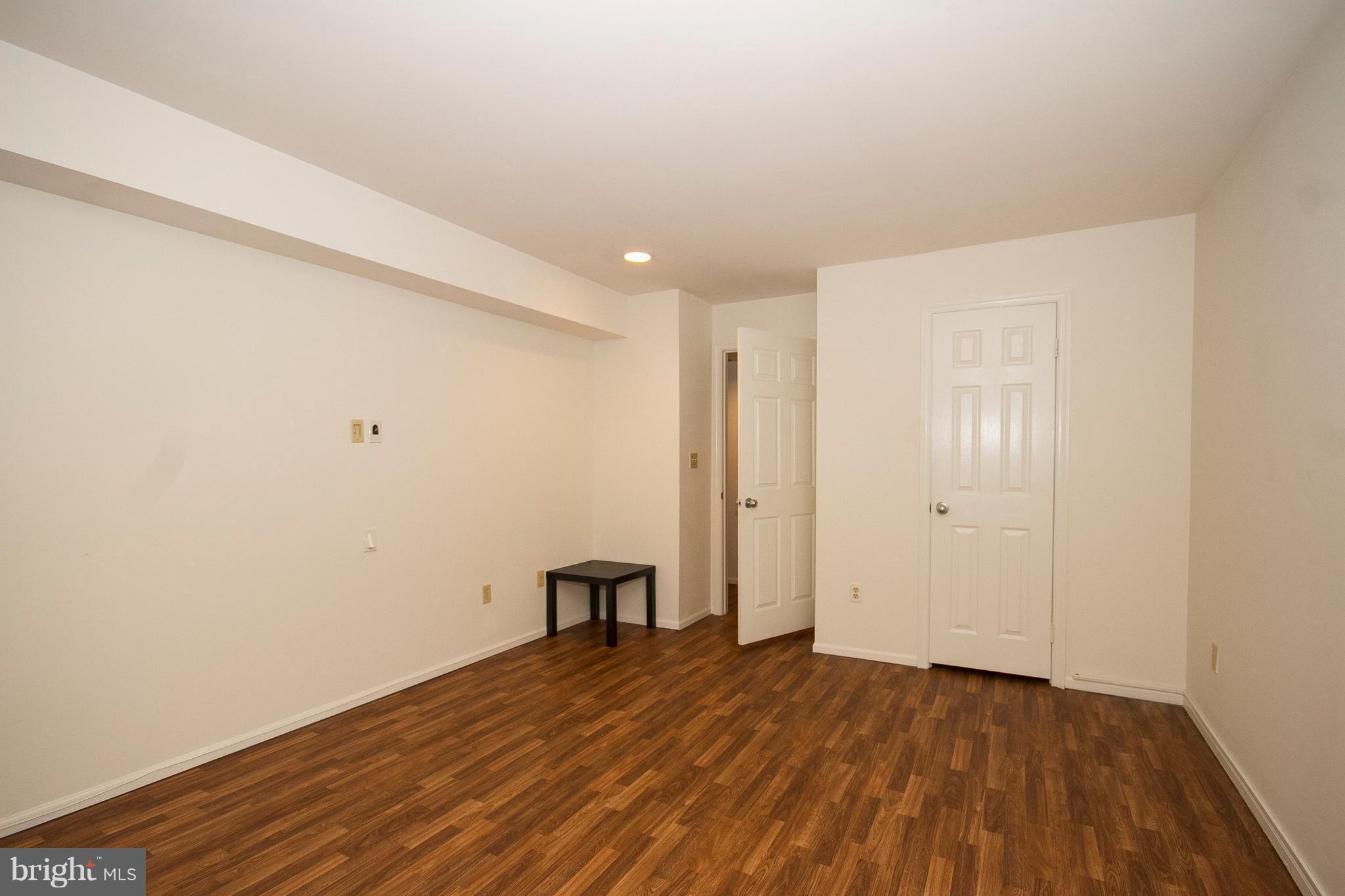 2901 Fallstaff Road, Unit 504 Baltimore, MD 21209 - Photo 13 of 22 a view of empty room with wooden floor