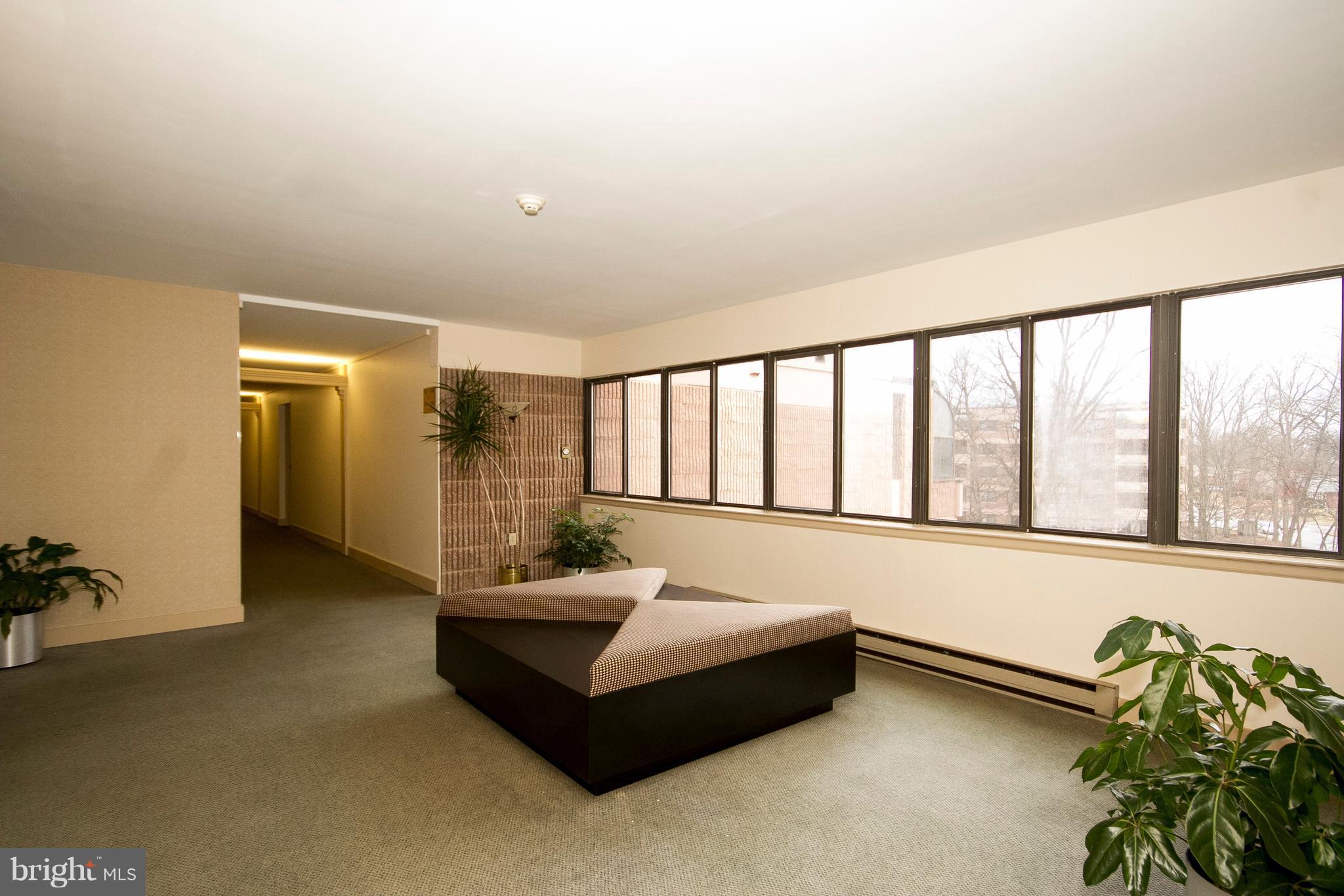 2901 Fallstaff Road, Unit 504 Baltimore, MD 21209 - Photo 21 of 22 a spacious bedroom with a bed and a large window