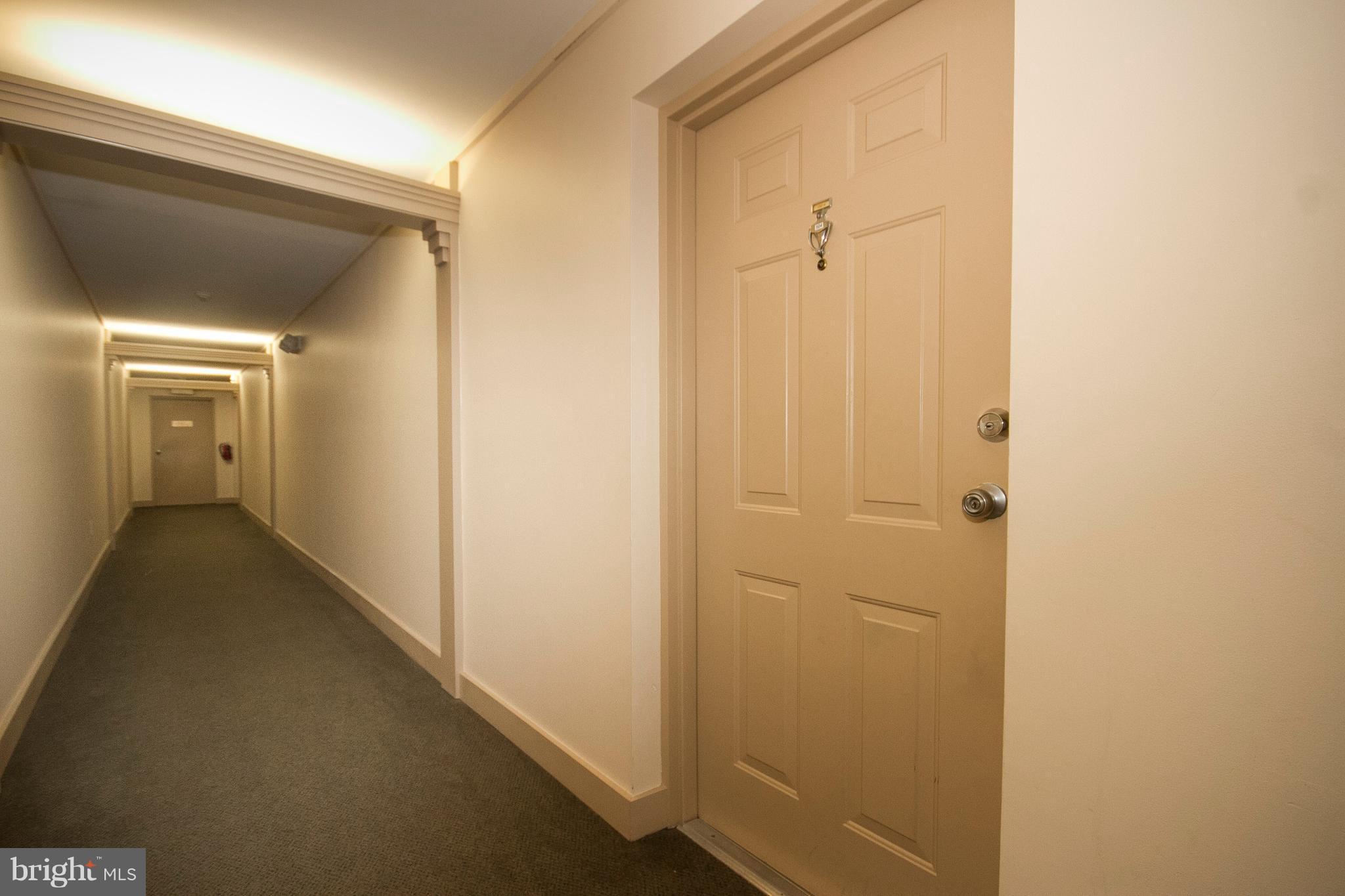 2901 Fallstaff Road, Unit 504 Baltimore, MD 21209 - Photo 22 of 22 a view of a hallway with wooden floor