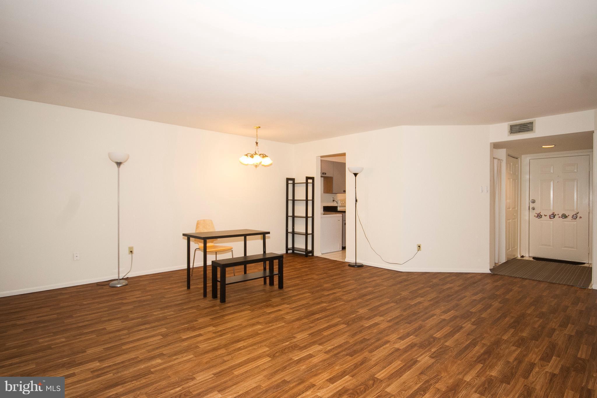 2901 Fallstaff Road, Unit 504 Baltimore, MD 21209 - Photo 6 of 22 a view of a room with wooden floor