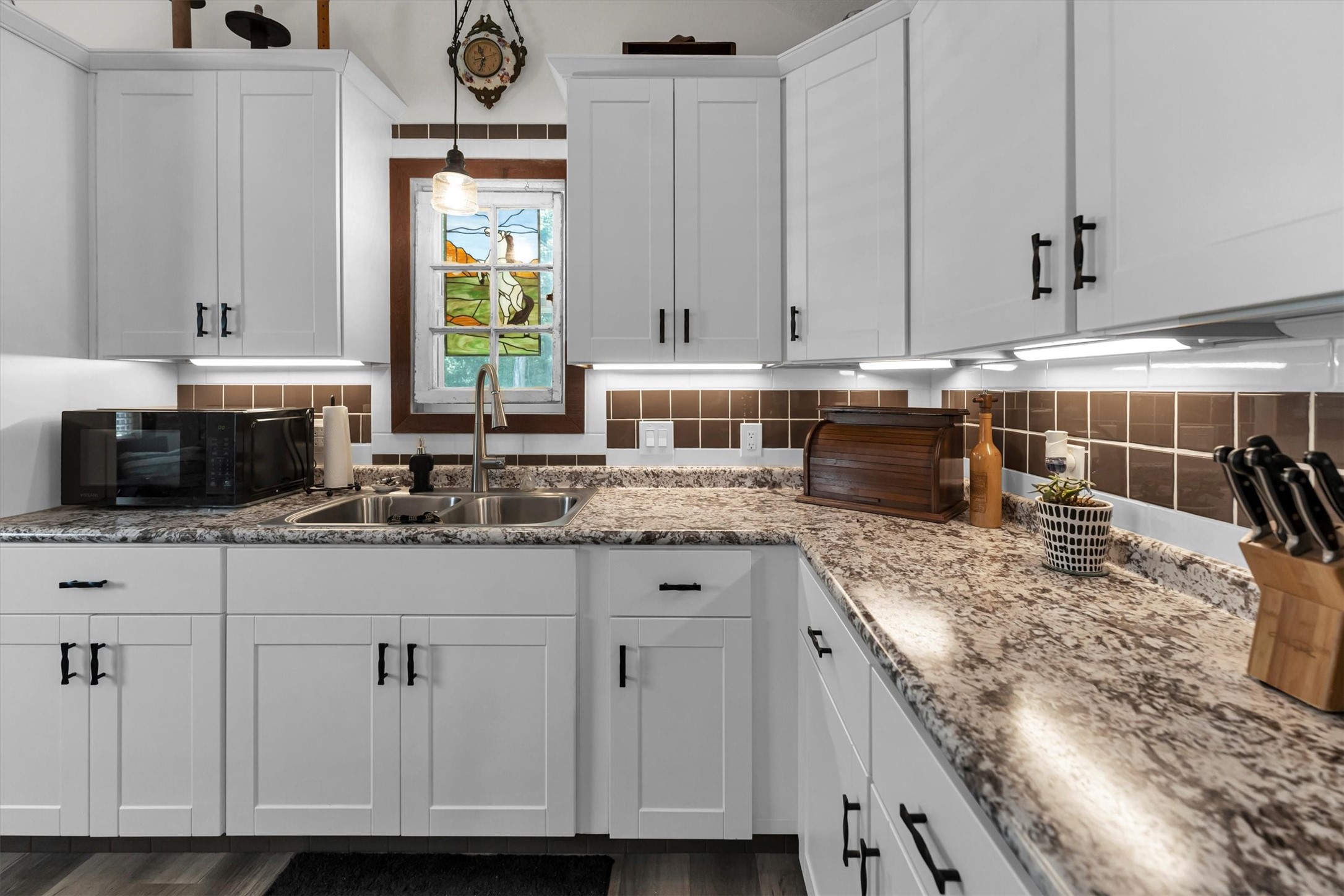 2075 Mangum Road Livingston, TX 77351 - Photo 17 of 45 a kitchen with granite countertop a sink a stove and cabinets