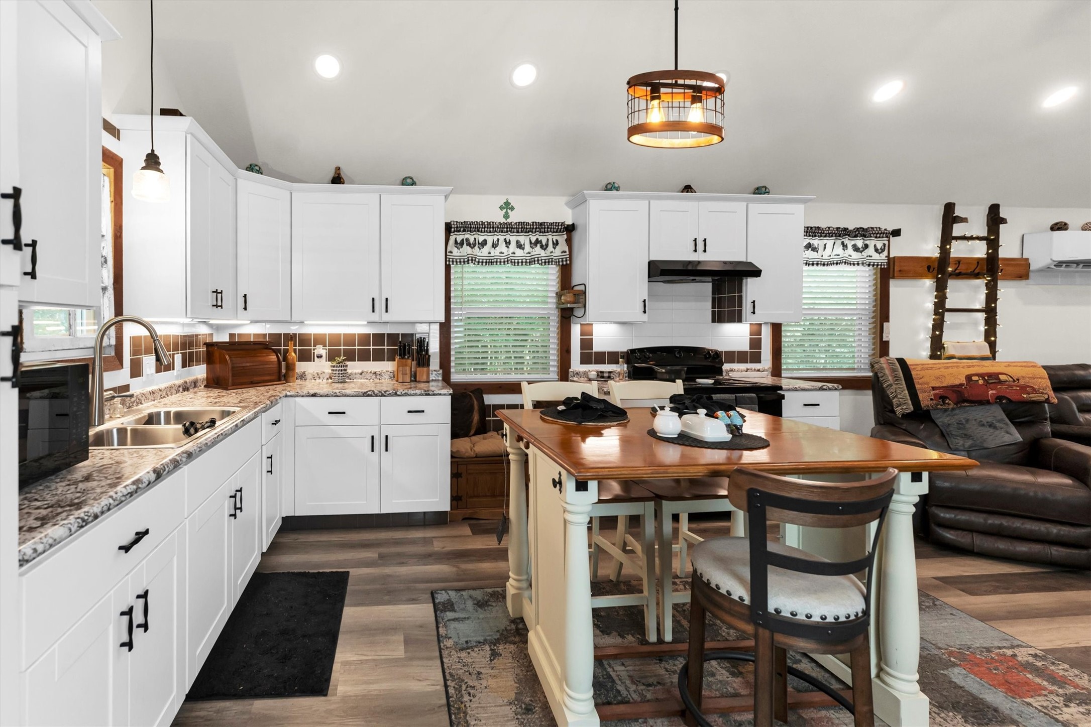2075 Mangum Road Livingston, TX 77351 - Photo 19 of 45 a kitchen with stainless steel appliances kitchen island granite countertop a sink and cabinets