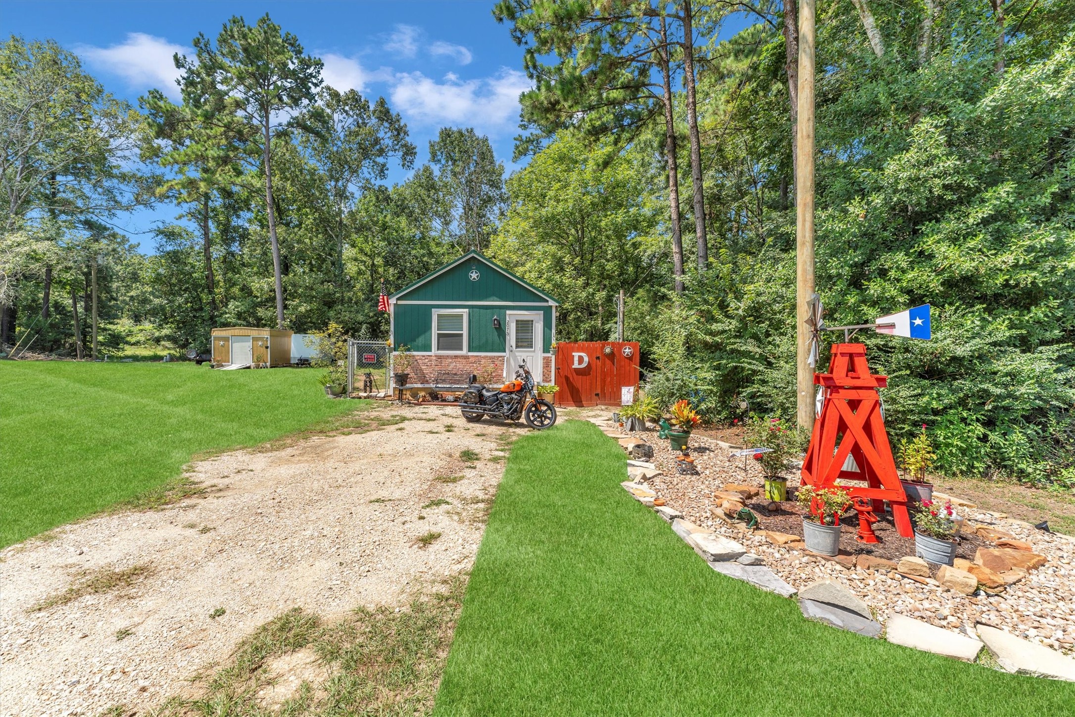 2075 Mangum Road Livingston, TX 77351 - Photo 2 of 45 a view of a park with plants and a slide