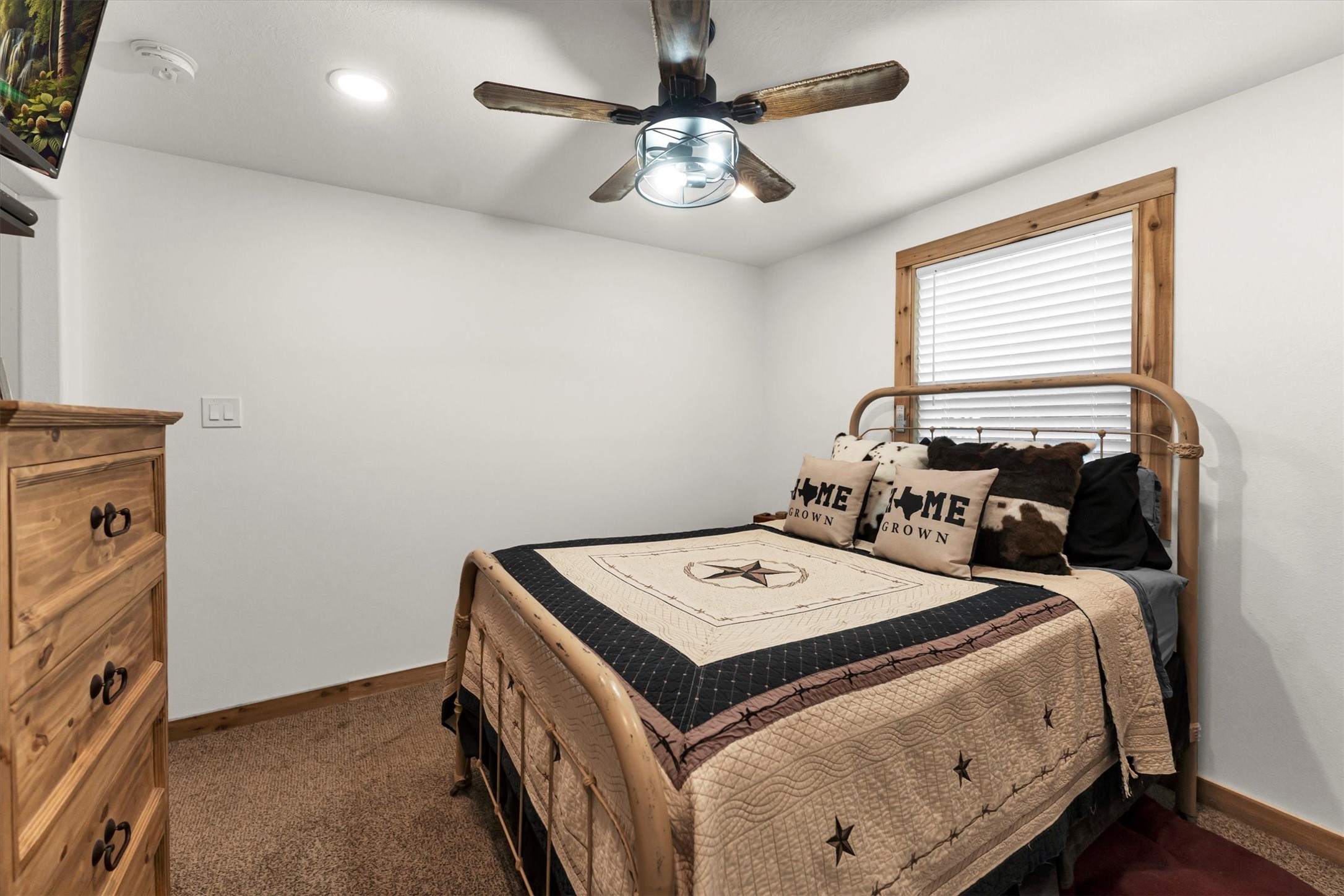 2075 Mangum Road Livingston, TX 77351 - Photo 27 of 45 a bed room with a bed and a chandelier