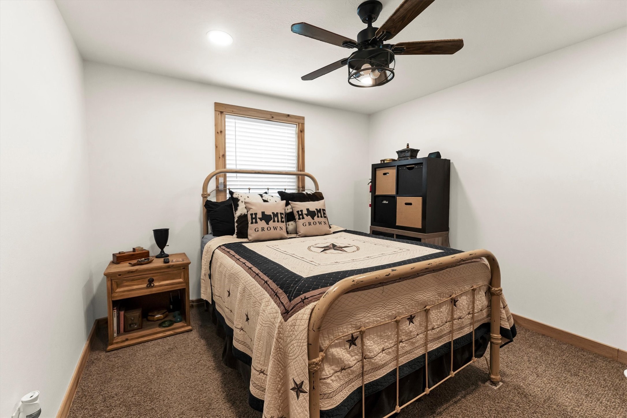 2075 Mangum Road Livingston, TX 77351 - Photo 28 of 45 a bedroom with a bed and a chandelier