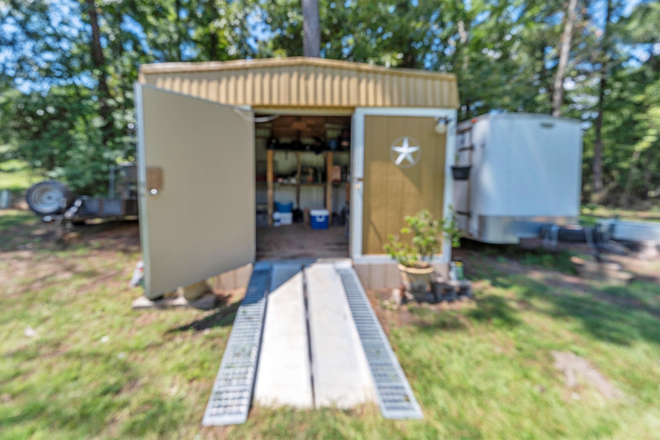 2075 Mangum Road Livingston, TX 77351 - Photo 34 of 45 a view of a house with a backyard