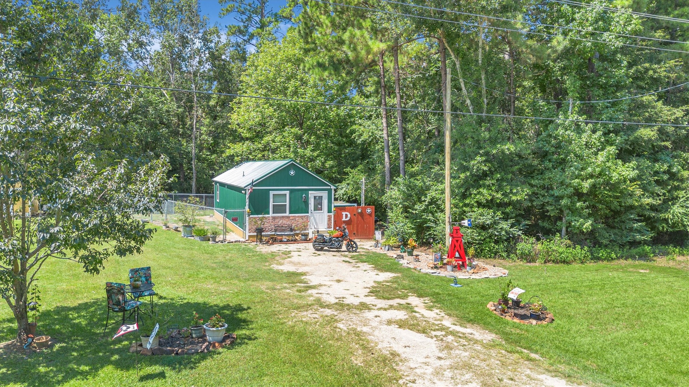 2075 Mangum Road Livingston, TX 77351 - Photo 35 of 45 a view of a house with a backyard and sitting area